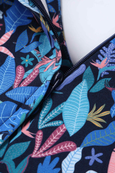 Short sleeve swing dress, with dinosaur leaf print, in navy blue, close up view