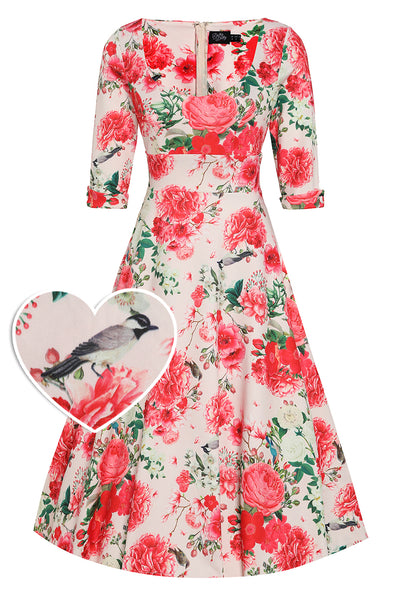 Front view of our half sleeved midi dress in beige pink floral print with birds