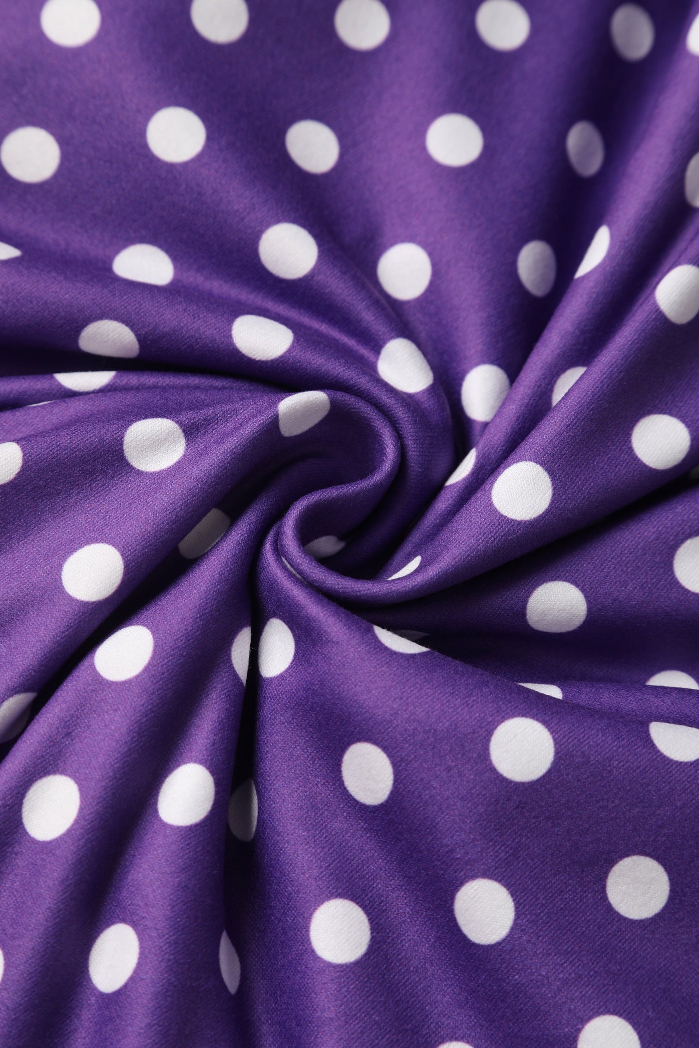 purple and white polka dot knit fabric