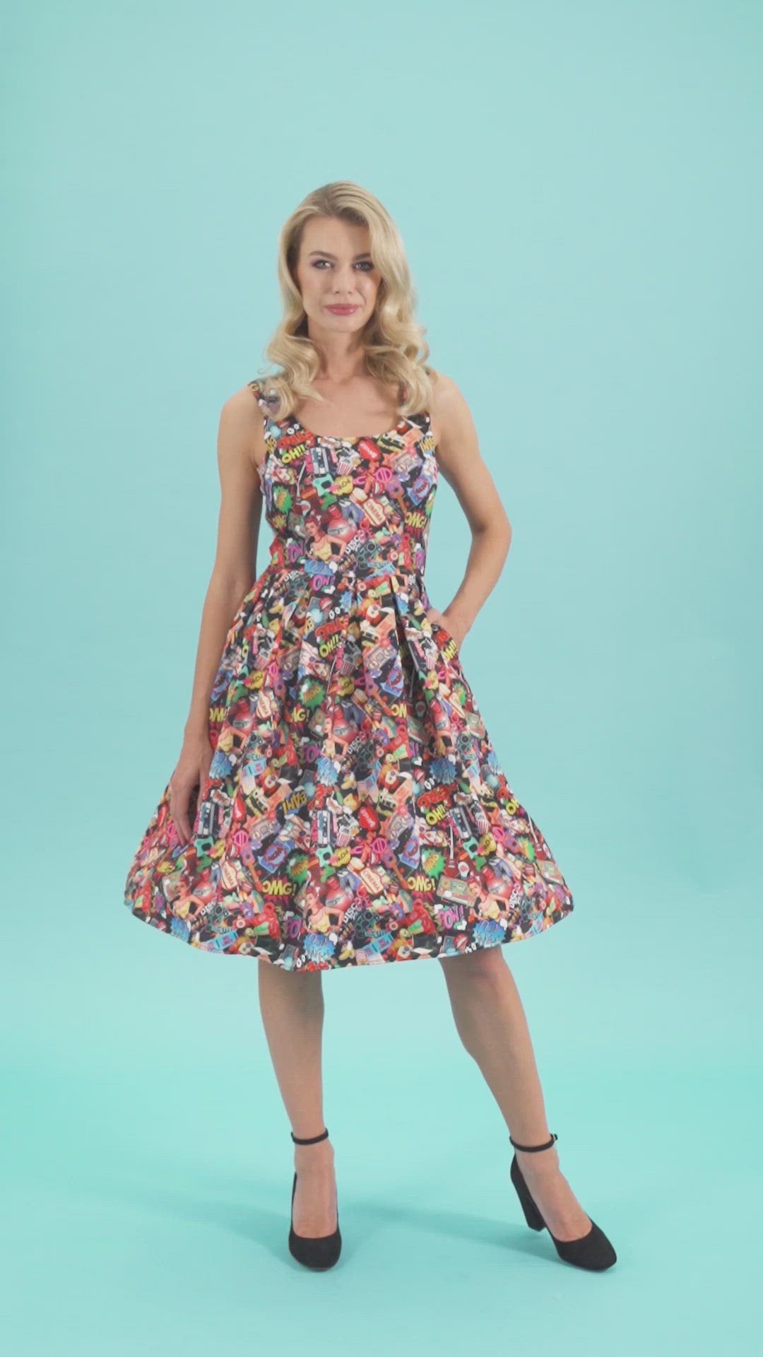 Video of a model twirling, wearing a Sleeveless Swing Dress with  Pop Art Print