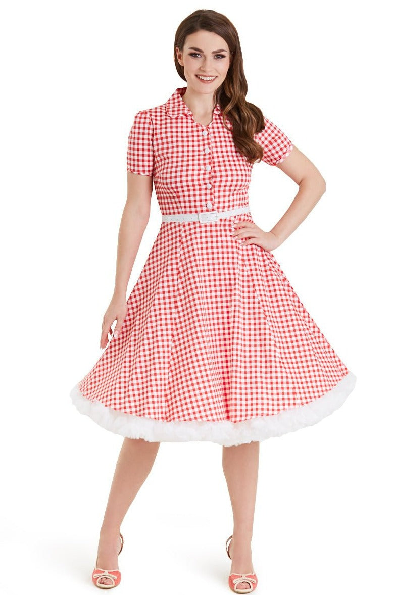 Model wears our short sleeve Penelope dress, in red and white gingham print, with petticoat, front view
