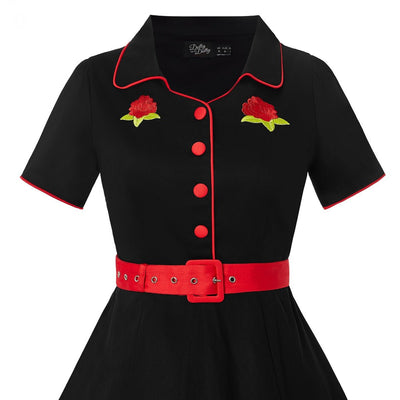 Short sleeved Sherry diner dress in black, with red buttons, belt and roses, close view