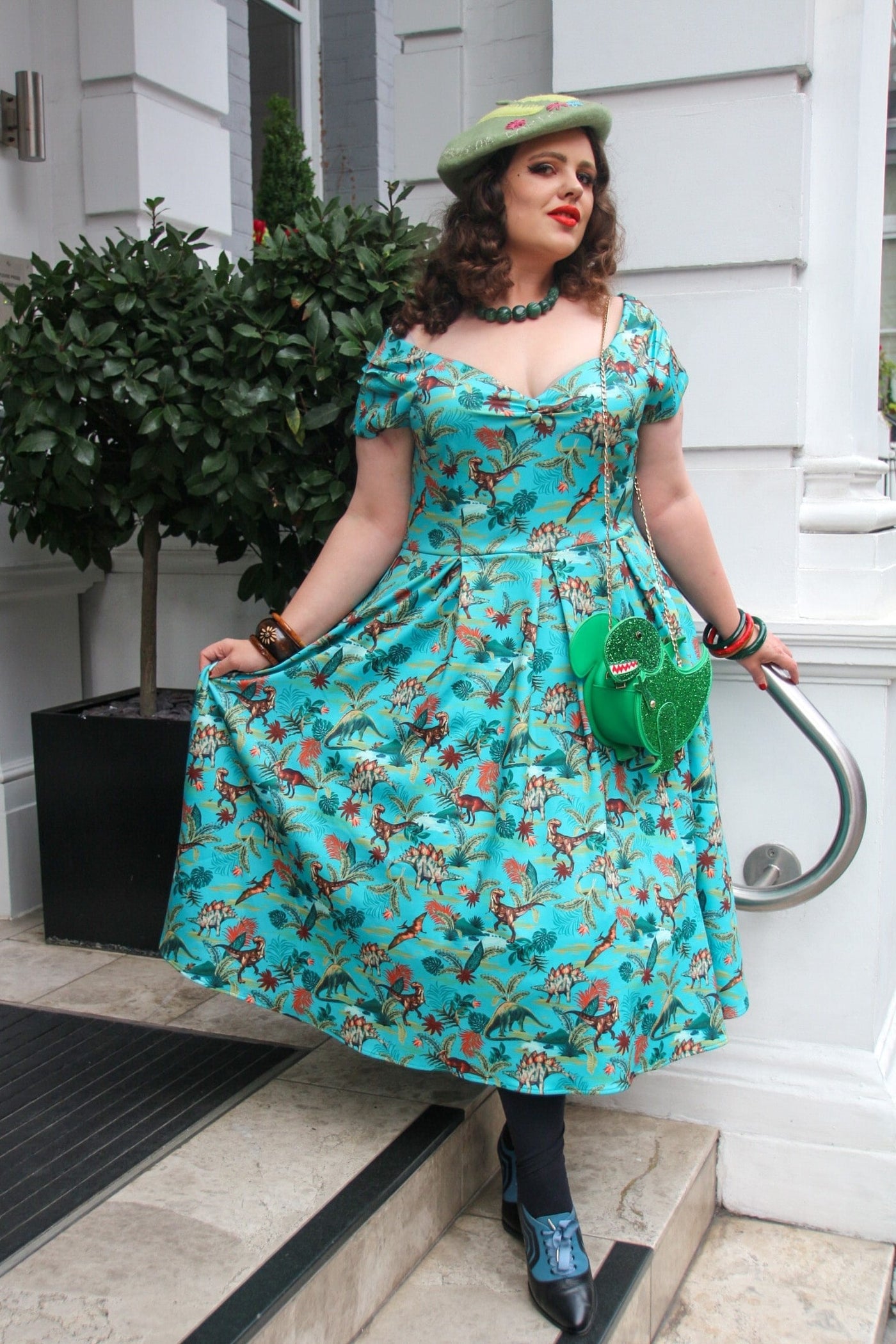 loisjelise wearing Vintage Forest Dinosaur T Rex Dress With Pockets In Green for dinosaur theme party