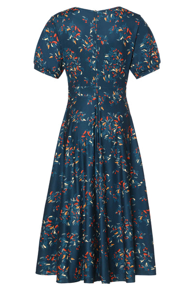 Back view of short sleeved blue midi dress, with red chili print