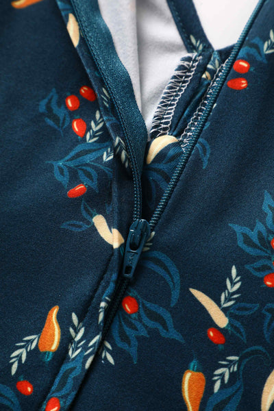 Zip view of short sleeved blue midi dress, with red chili print