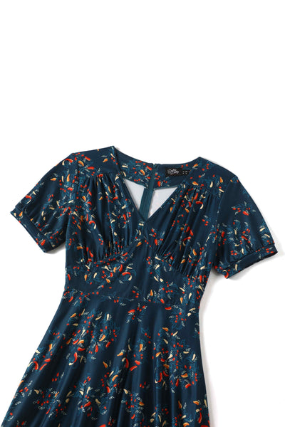 Top down view of short sleeved blue midi dress, with red chili print