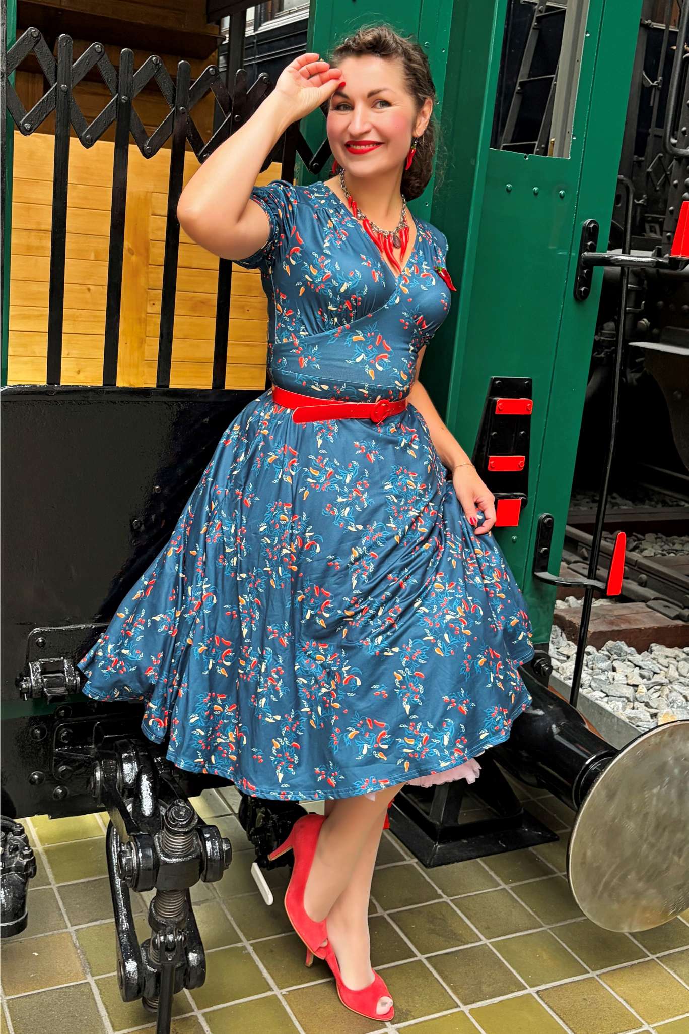 A lovely lady wearing a Julia Navy Blue Chili Midi Dress