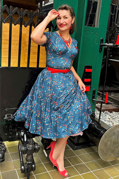 A lovely lady wearing a Julia Navy Blue Chili Midi Dress
