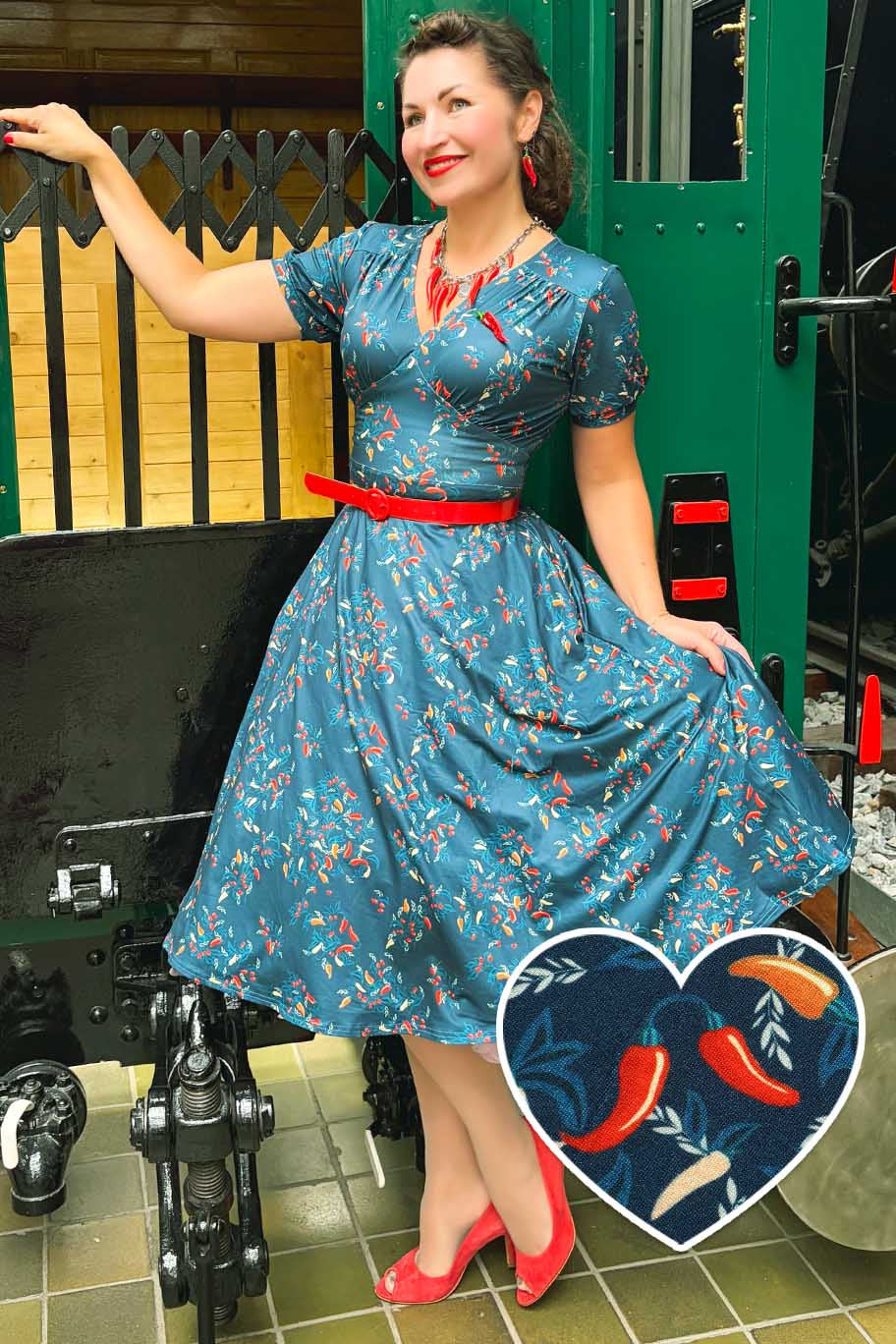 A lady wearing a Julia Navy Blue Chili Midi Dress