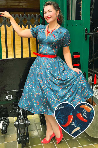 A lady wearing a Julia Navy Blue Chili Midi Dress