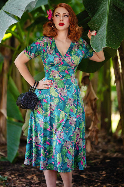 A model wearing a 50s Style Cheetah Sleeved Dress