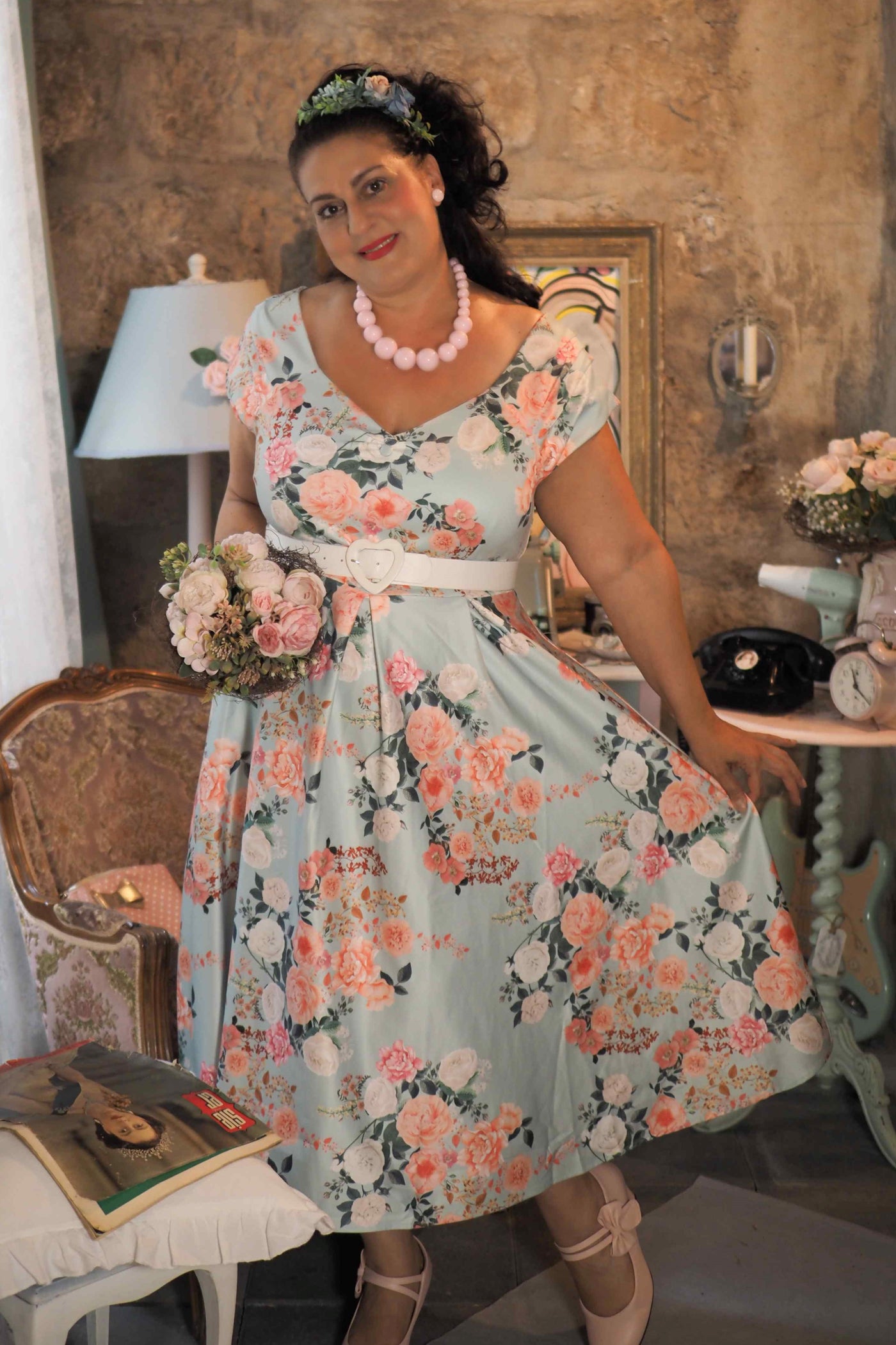 A lovely lady wearing a 50s Style Floral Off Shoulder Dress In Mint