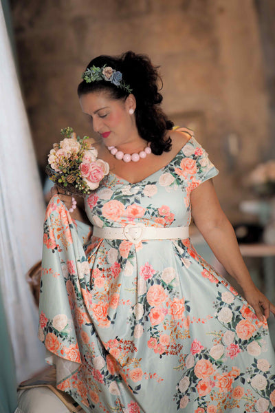 A lovely lady wearing a 50s Style Floral Off Shoulder Dress In Mint