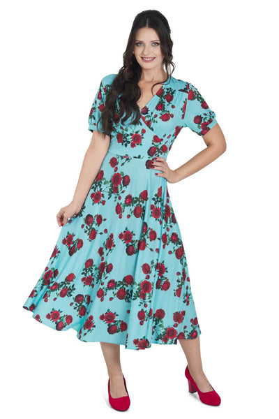 Model wearing 50s Style Red Rose Sleeved Dress in Blue