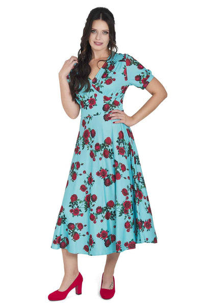 Model wearing 50s Style Red Rose Sleeved Dress in Blue