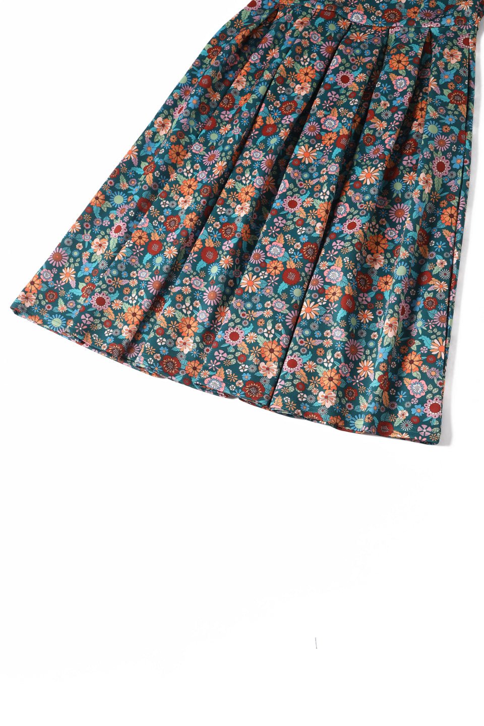 Close up view of 70s Floral Swing Dress In Peacock Blue