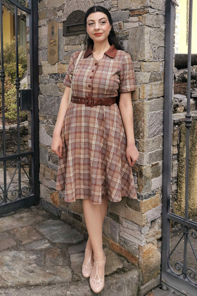 A lady wearing a Brown Tartan Shirt Dress