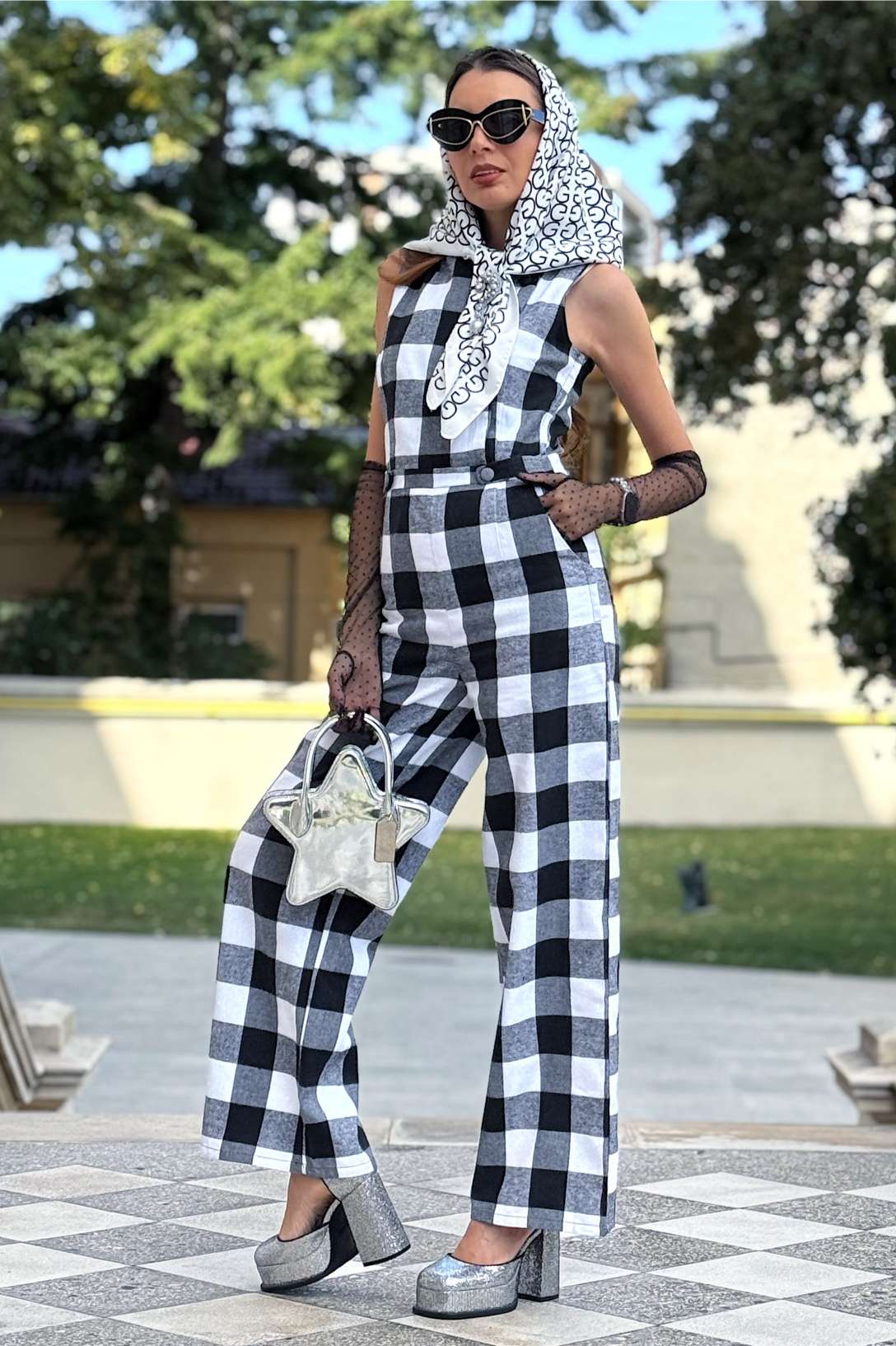 A lovely model wearing a Sylvia Monochrome Check Jumpsuit