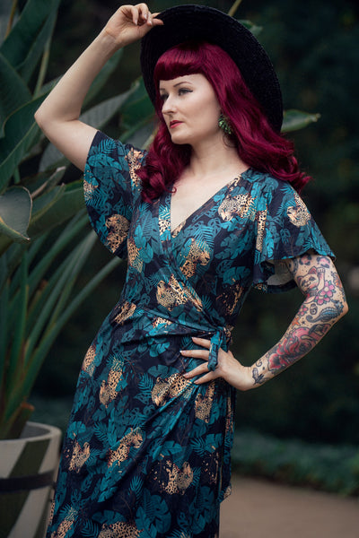 A lady wearing an Isla Maxi Wrap Dress In Cheetah Jungle Print