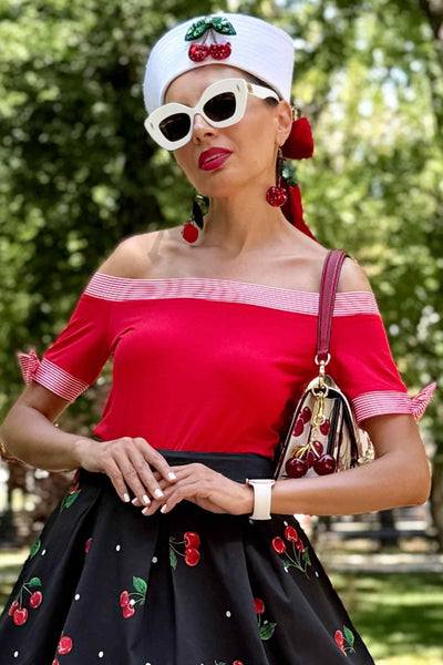A model wearing a Layla Off Shoulder Red Striped Trim Top
