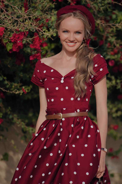 A lady wearing a Off Shoulder Polka Dot Evening Dress in Burgundy/White