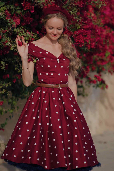 A lady wearing a Off Shoulder Polka Dot Evening Dress in Burgundy/White