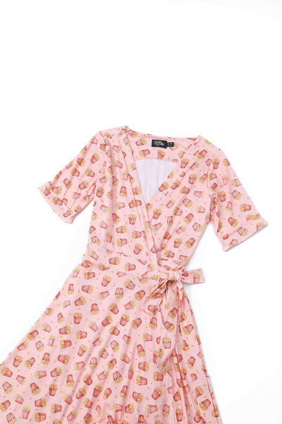 Close up view of Popcorn Wrap Dress In Light Pink