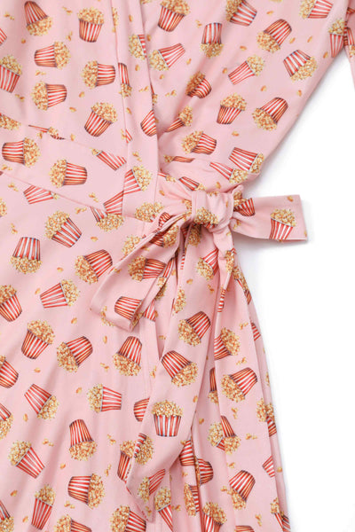 Close up view of Popcorn Wrap Dress In Light Pink