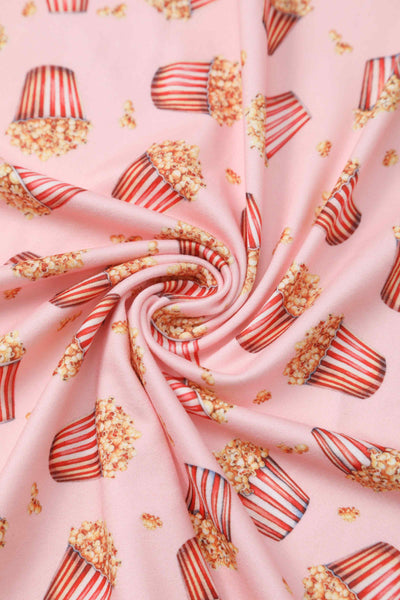 Close up view of Popcorn Wrap Dress In Light Pink