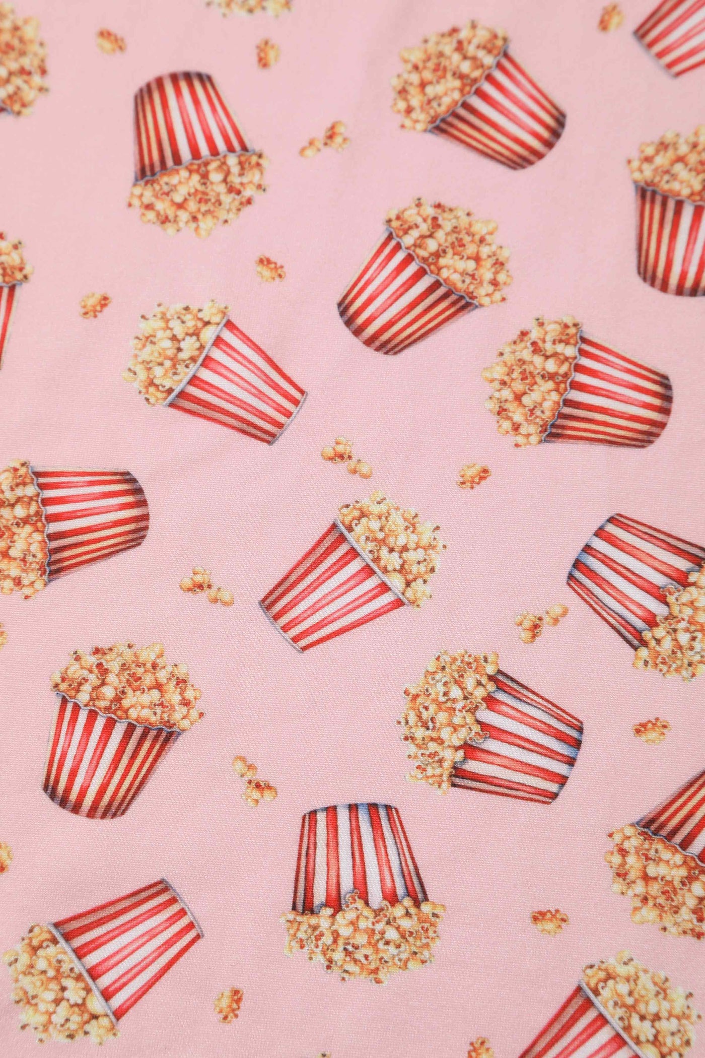 Close up view of Popcorn Wrap Dress In Light Pink