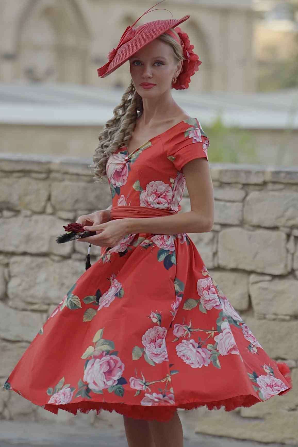 A lady wearing a Lily Red Rose Off Shoulder Midi Dress