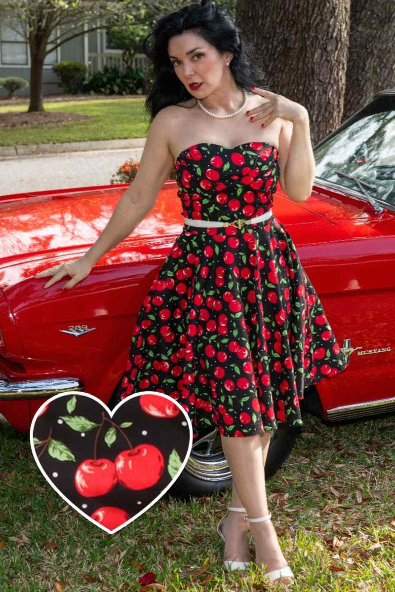 A lady wearing a Retro Cherry Dress