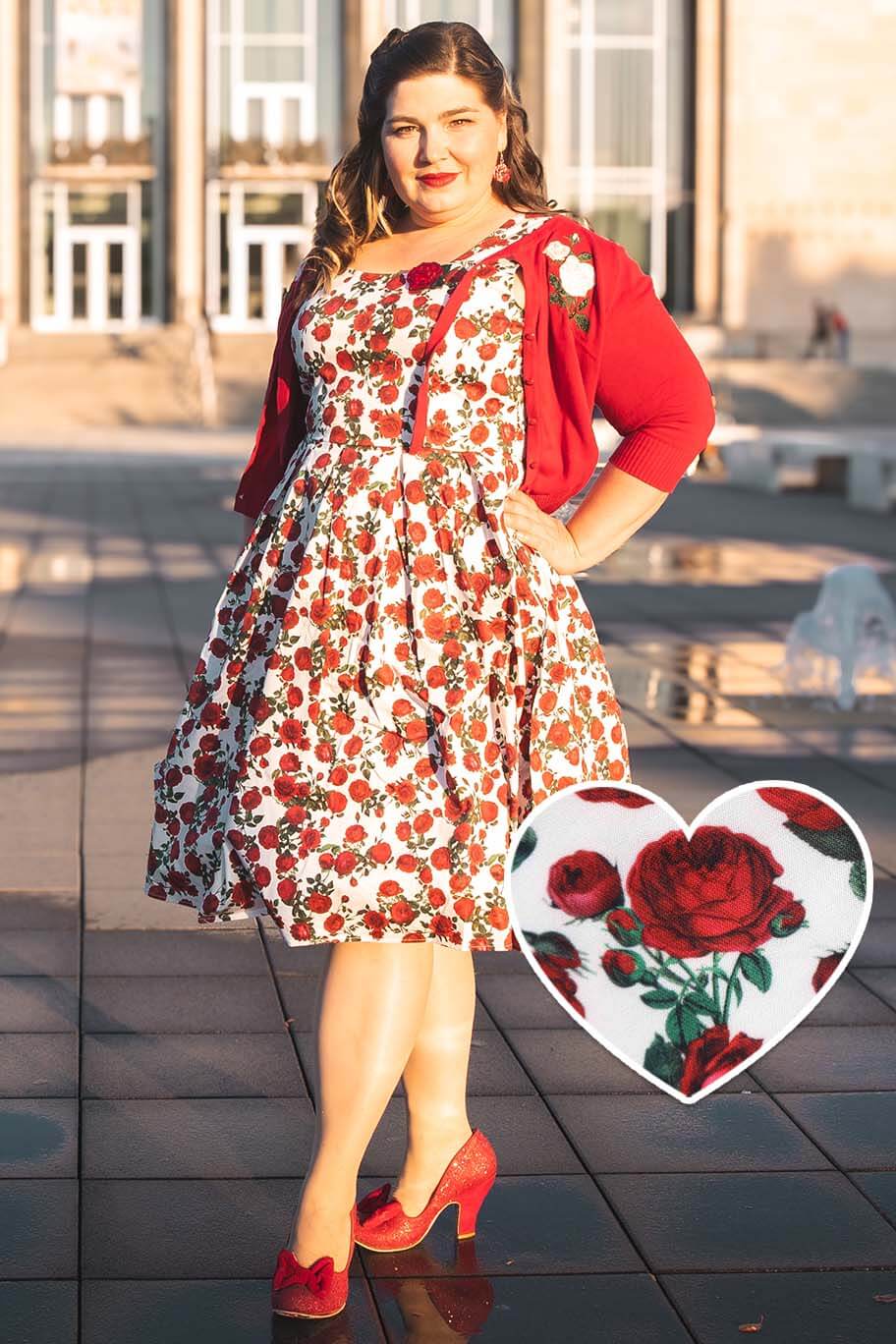 A model wearing an Amanda Retro Red Roses Swing Dress In White