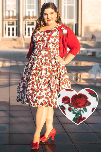 A model wearing an Amanda Retro Red Roses Swing Dress In White