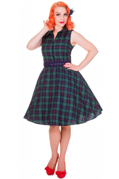 Model wears our sleeveless Poppy button up dress in green tartan print, front view