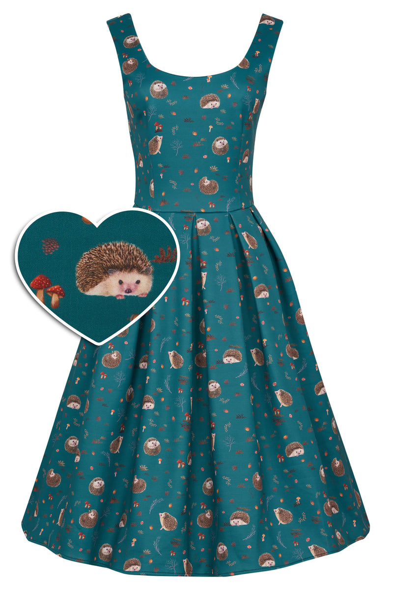 Front view of our sleeveless swing dress, in teal hedgehog and mushroom print