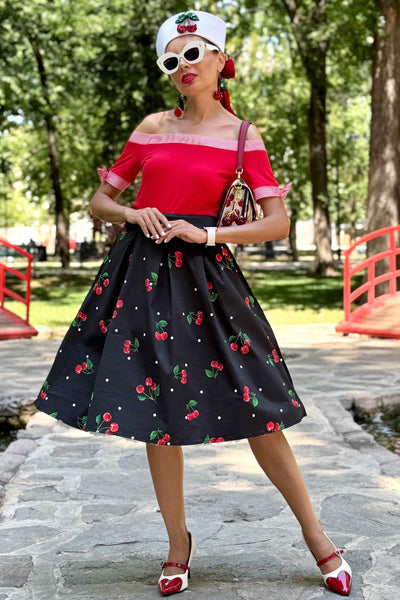 A lady wearing a Carolyn Polka Dot Cherry Black Flared Skirt
