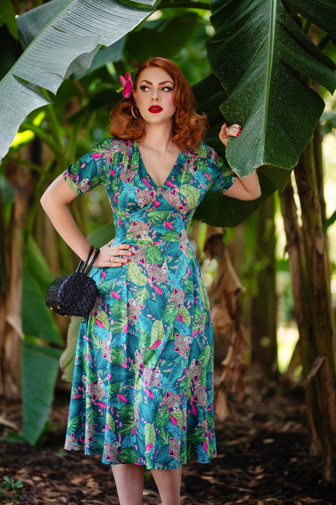A lady wearing a Tropical Cheetah Midi Dress