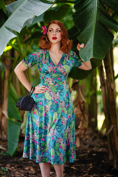 A lady wearing a Tropical Cheetah Midi Dress