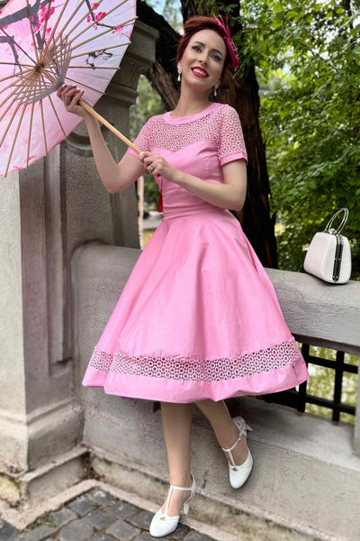 A woman wearing a Crochet Lace Formal Dress In Light Pink
