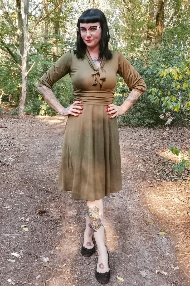A model wearing Vintage-Inspired Stretchy Bow Tie Dress