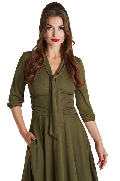 A model wearing Vintage-Inspired Stretchy Bow Tie Dress
