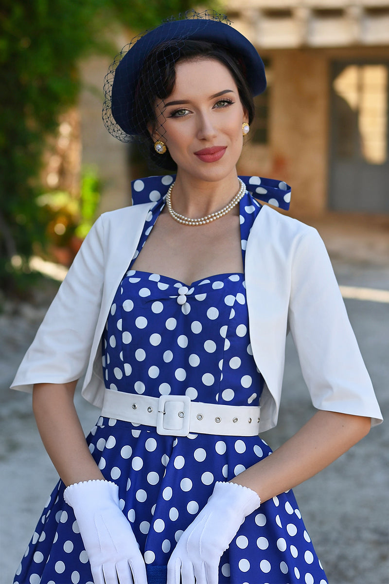 A woman wearing a Lisette White Bolero Jacket