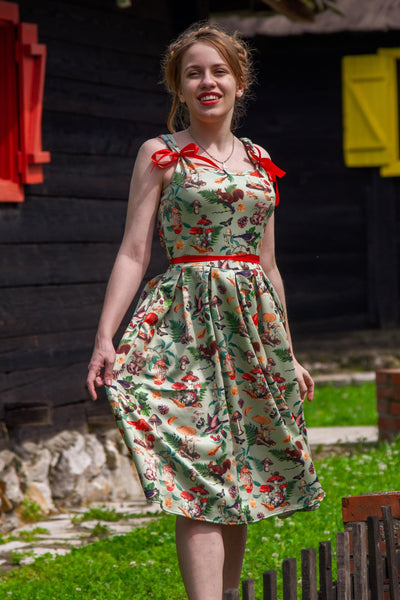 A model wearing a Woodland Flared Dress In Tea Green