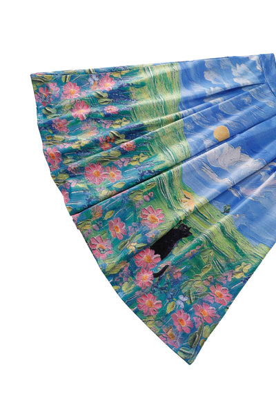 Close up view of Aisley Cat Adventure Pleated Midi Skirt