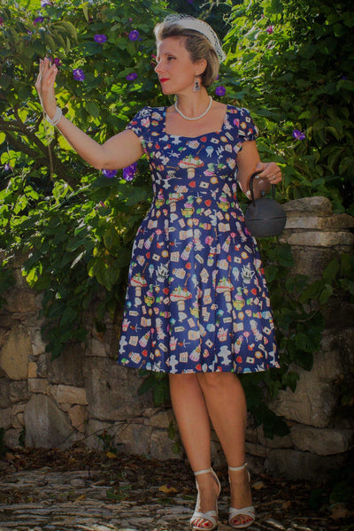 A lady wearing a Alice In Wonderland Sleeved Dress
