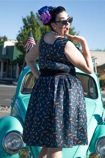 A lovely model wearing an Amanda Dinosaur In Space Flared Dress
