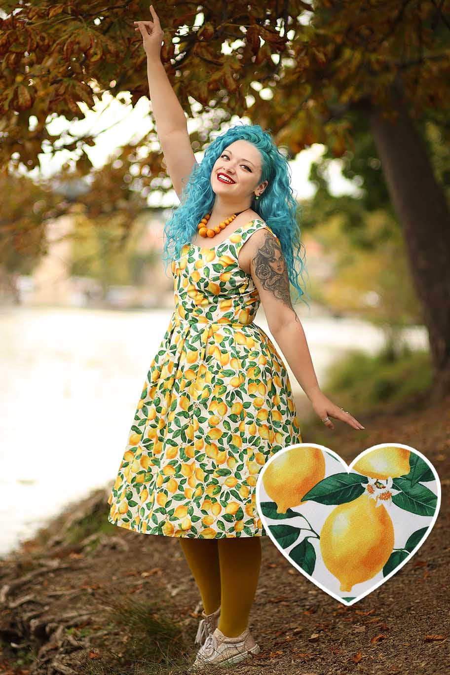 A model wearing an Amanda Lemon Flared Dress In White