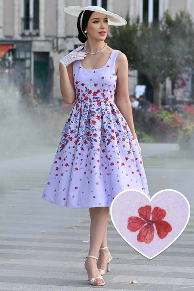 A model wearing an Amanda Lilac Falling Flower Swing Dress