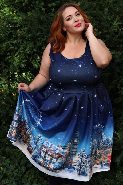 A lady wearing an Amanda London Winter Swing Dress
